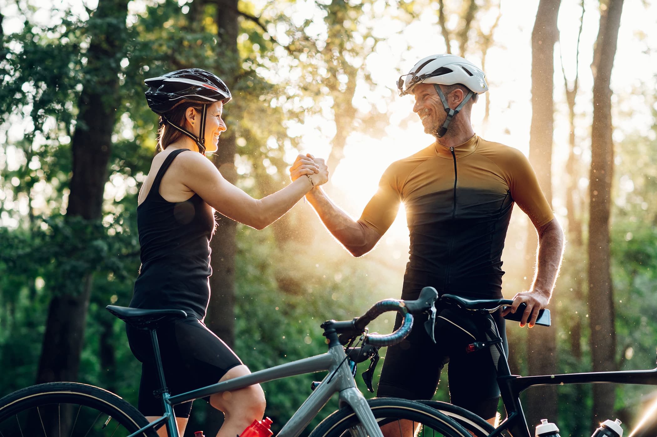 Couple getting ready for a race on their bicycles 